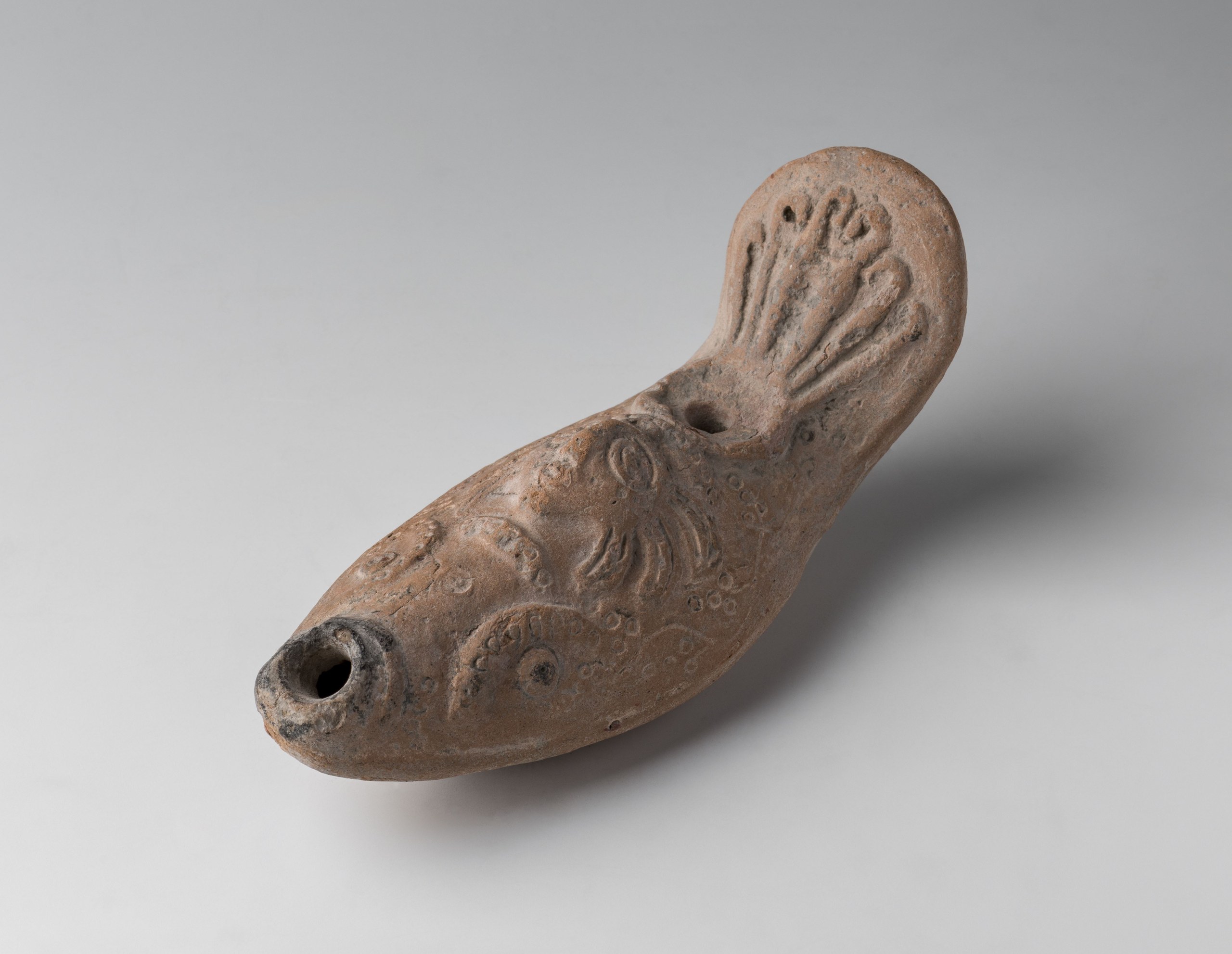 Lamp with palmette handle, graced with a Gorgon's face