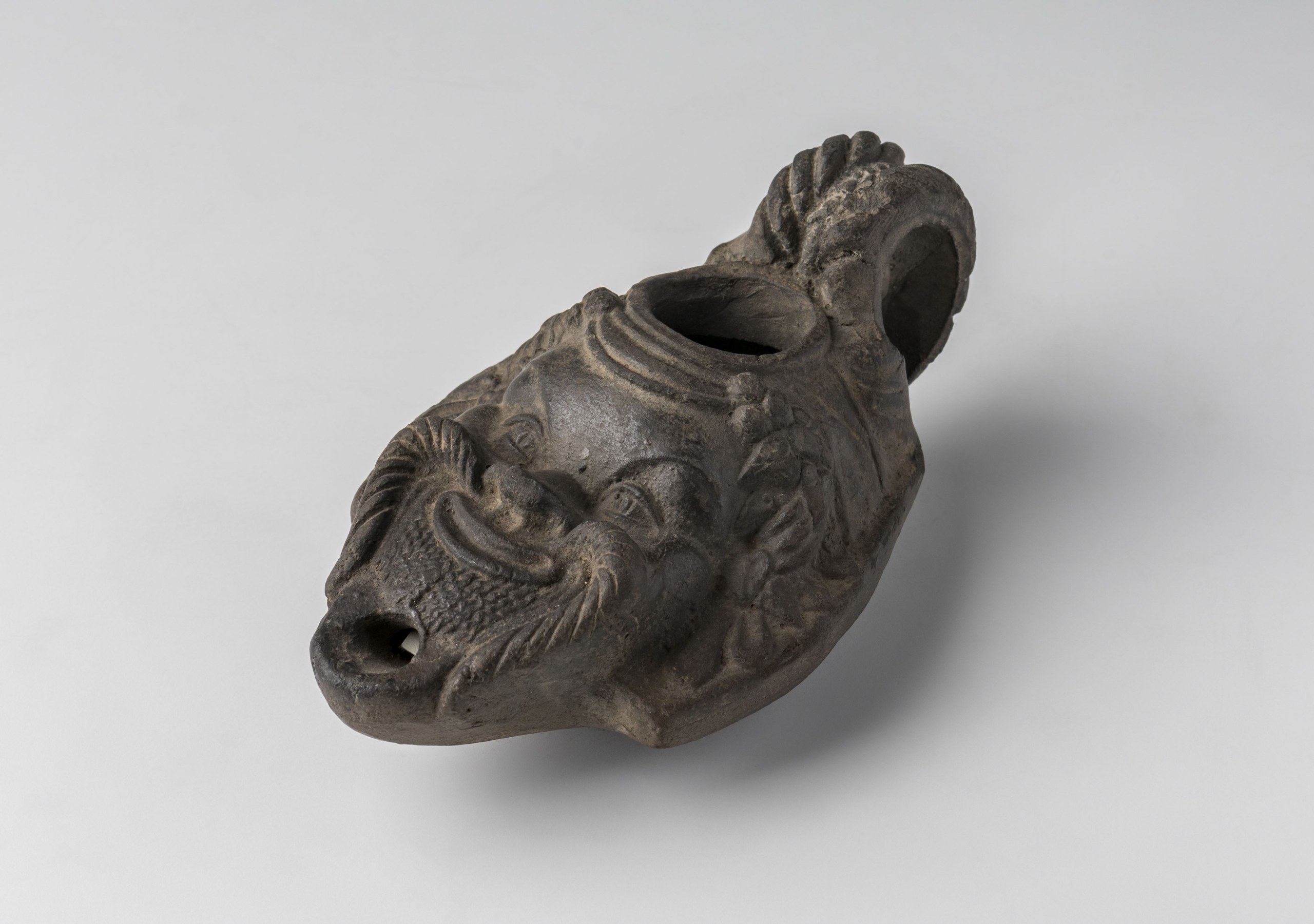 Lamp shaped as a satyr mask